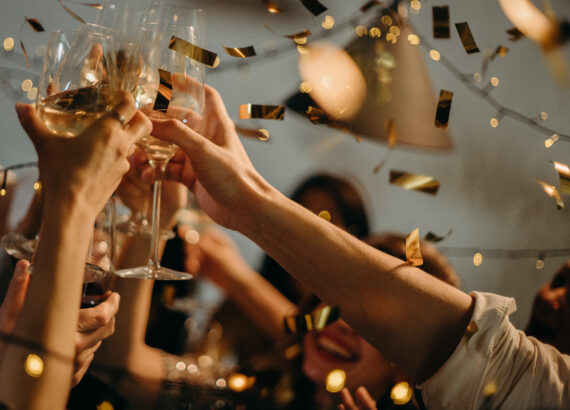 People toasting wine glasses